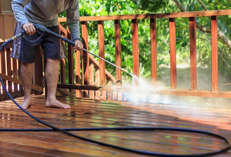 thai-man-pressure-washing-timber_30478-3738 pressure washing services in Australia